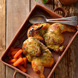 Honey, lemon and thyme chicken spatchcock served with glazed carrots